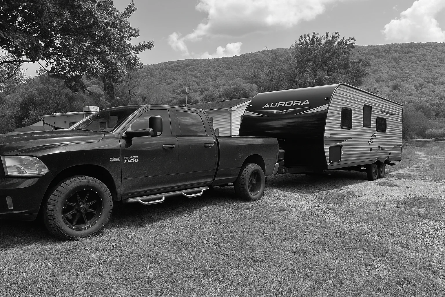 Truck towing the RV Fam Adventure travel trailer for a family campground trip