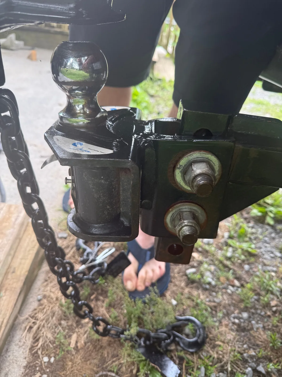Close view of our weight-distribution hitch coupler and safety chains