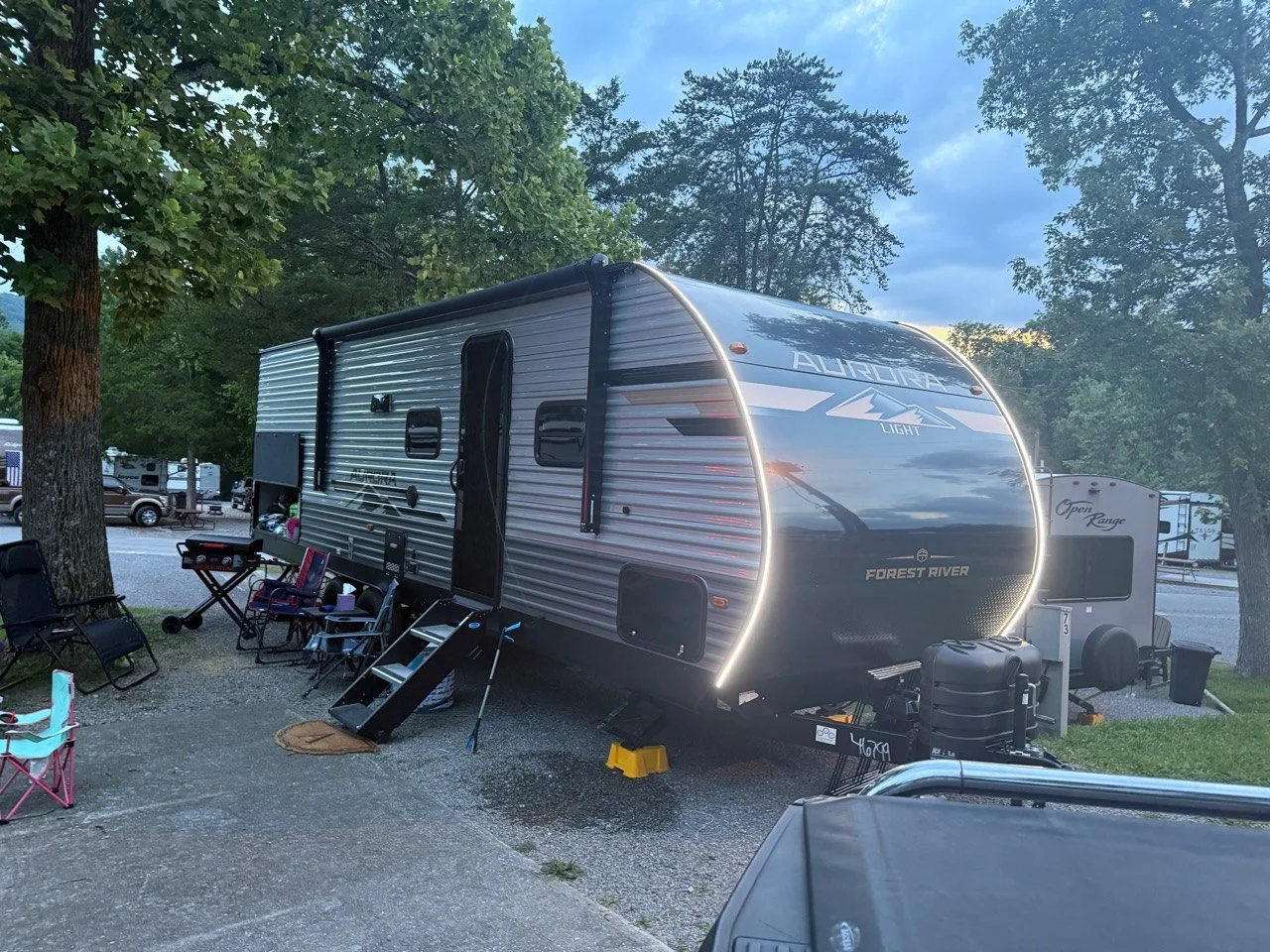 Our Aurora travel trailer set up for an evening at the campground